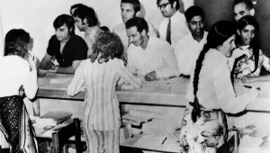 Ugandan Asians have their papers examined by ship's officer of the SS Haryana before they boarded the ship