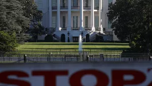The White House stands behind a vehicle barrier, Sunday, June 7, 2020.