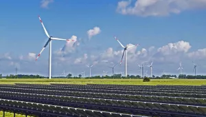 Solar panel field and wind turbines