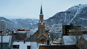 A snowy church steeple in Tromsø, Norway.