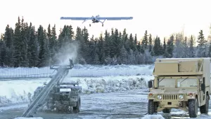 An RQ7 Shadow unmanned aircraft flies from its pneumatic catapult launcher.