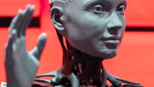 A robot with hand raised 