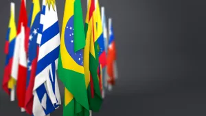 Flags grouped together in front of a gray background