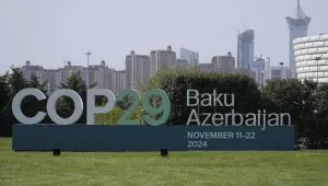 A sign for COP29, the United Nations Climate Change Conference, is on display in Baku, Azerbaijan
