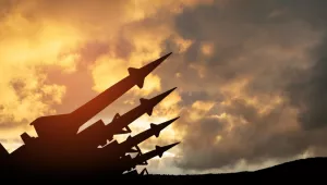 Nuclear Missiles against Clouded Sunset Sky