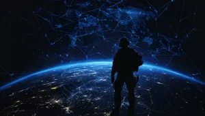 Silhouette of a soldier standing on the Earth with a blue, glowing world map in the background, connecting lines between cities and a global network connection.