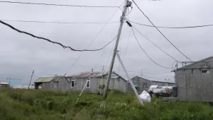 Power poles lean in the village of Newtok, Alaska on Wednesday, Aug. 14, 2024.
