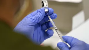 A healthcare worker fills a syringe with the Pfizer COVID-19 vaccine at Jackson Memorial Hospital on Oct. 5, 2021, in Miami. (AP Photo/Lynne Sladky, File)