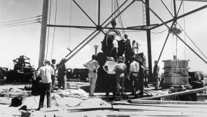 FILE - Scientists and other workers rig the world's first atomic bomb to raise it up onto a 100-foot tower at the Trinity Test Site near Alamogordo, N.M. The New Mexico site where the world’s first atomic bomb was detonated is expecting thousands of visitors Saturday due to the popularity of the movie, "Oppenheimer." Trinity Site, a designated National Historic Landmark, only opens to the public twice a year. (AP Photo/File )