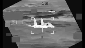 In this image made from video provided by U.S. Indo-Pacific Command, a People's Republic of China J-11 is seen from a U.S. Air Force B-52 aircraft, over the South China Sea on Oct. 24, 2023.