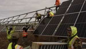 Workers install panels at a solar project May 21, 2025, in Galena, Alaska.
