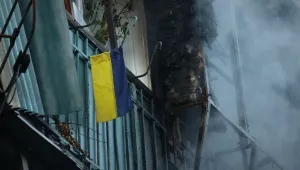 An Ukrainian flag hanging on the balcony is seen after a Russian strike in Zaporizhzhia, Ukraine.