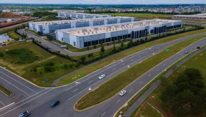 Cars drive past data centers that house computer servers and hardware required to support modern internet use, such as artificial intelligence, in Ashburn, Virginia, July 16, 2023.