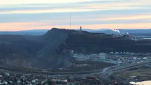 Kirunavaara and Kiruna Iron Mine in Kiruna (Sweden) as seen from Luossavaara at sunset in 2022.
