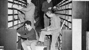 Corporal George Carter, top left, Union, West Virginia; Private Jack Easton, top right, Cokato, Minnesota; Private James Bosica, bottom left, Baltimore, Md., and Technical Sergeant William Cripps, bottom right, Houston, Texas, now with American troops in Great Britain check parts in the stores at the repair and supply depot of the United States Army Air Force Service Command in Britain, August 21, 1942. (Associated Press)