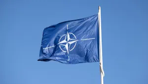 NATO Flag against a blue sky