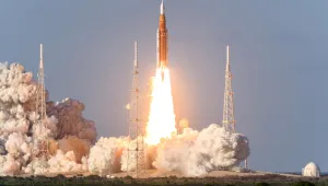 Rocket takes off into the sky. Lots of smoke and gas. The elements of this image furnished by NASA.