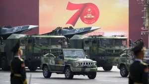 Chinese military vehicles carrying DF-17 ballistic missiles roll during a parade to commemorate the 70th anniversary of the founding of Communist China in Beijing, Tuesday, Oct. 1, 2019. 