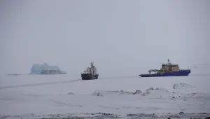An icebreaker makes a path for a cargo ship near Nagurskoye, Russia, May 17, 2021.