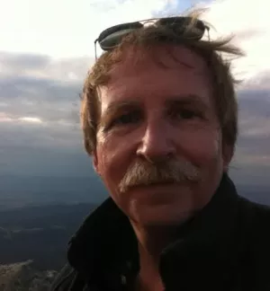 An image of Steedman Hinckley standing outside with the sky in the background.