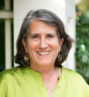 Rachel Morello-Frosch, a smiling middle-aged woman with short gray hair and a green blouse.