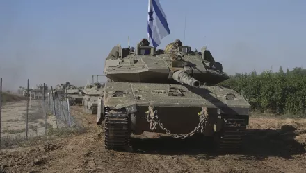 A convoy of Israeli army tanks maneuvers near Israel's border after leaving Gaza, southern Israel, on Friday, Nov. 24, 2023.