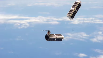 A set of NanoRacks CubeSats is photographed by an Expedition 38 crew member after the deployment by the Small Satellite Orbital Deployer (SSOD).