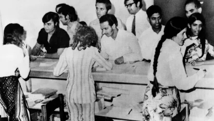 Ugandan Asians have their papers examined by ship's officer of the SS Haryana before they boarded the ship