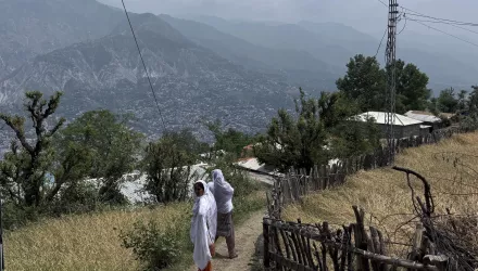 Villager women walk on a dusty track during a government's organized trip for media to Bella Noor Shah, a mountainous village near Muzaffarabad, the capital of Pakistan administered Kashmir, Monday, May 5, 2025.
