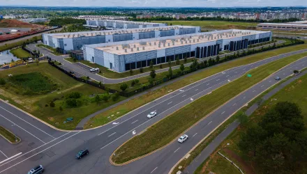 Cars drive past data centers that house computer servers and hardware required to support modern internet use, such as artificial intelligence, in Ashburn, Virginia, July 16, 2023.