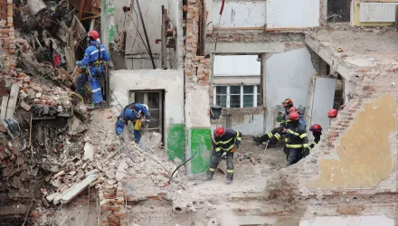 Rescue workers clear the rubble of a residential building which was heavily damaged by a Russian strike on Ternopil, Ukraine, Friday, Nov. 21, 2025.
