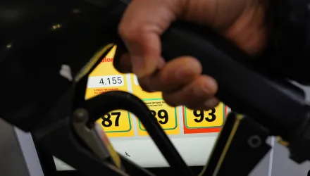 A person fills up her vehicle's gas tank at a gas station in Buffalo Grove, Ill., Thursday, April 2, 2026. (AP Photo/Nam Y. Huh)