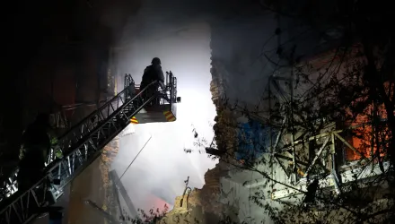 Rescue workers try to put out a fire of a residential building burning after a Russian drone attack on Zaporizhzhia, Ukraine, late Sunday, July 12, 2026. (AP Photo/Kateryna Klochko)