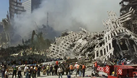 In this Thursday, Sept. 13, 2001 file photo, rescue workers continue their search as smoke rises from the rubble of the World Trade Center in New York.