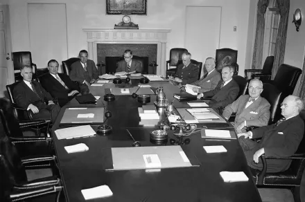 Photo of President Harry Truman meeting with members of the National Security Council and other advisers Jan. 24, 1952 for review of the defense situation. 