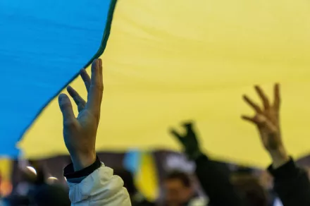 Hands and Ukrainian Flag