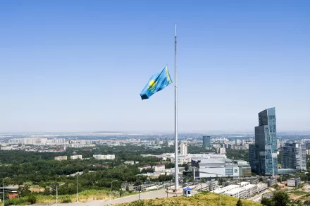 A Kazakhstan national flag flies at half staff over Almaty, Kazakhstan, Monday, July 13, 2020.