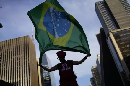 Brazil flag held up by a supporter of President Luiz Inacio Lula da Silva at a rally