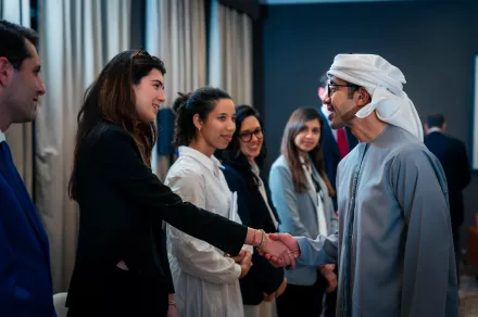 HKS Student shaking hands with UAE Foreign Minister HH Sheikh Abdullah bin Zayed