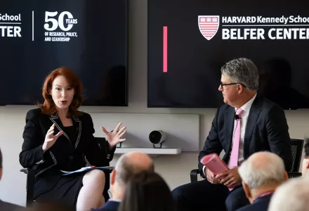 Meghan O'Sullivan and Eric Rosenbach sitting in front of screens with the Belfer Center 50 logo.