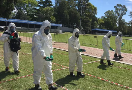 Handheld radiation monitors are used during an IAEA exercise in Argentina in 2018.