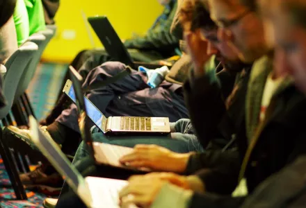 image of people typing on laptops