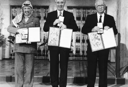 PLO Leader Yasser Arafat, left, Israeli Foreign Minister Shimon Peres, center, and Israeli Prime Minister Yitzhak Rabin, right, and pose with their medals and diplomas, after receiving the 1994 Nobel Peace Prize in Oslo's City Hall.