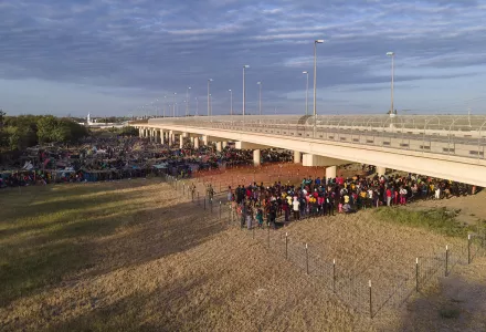 In this Sept. 22, 2021, file photo, migrants, many from Haiti, are seen in a pen area waiting to load onto buses near the Rio Grande, in Del Rio, Texas.