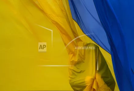 Ukrainian honor guard soldiers take part in a national flag-raising ceremony during a commemorative event on the anniversary of the liberation of the territories from the Russian troops in Bucha, on the outskirts of Kyiv, Ukraine, Friday, March 31, 2023.