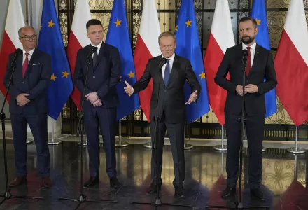 Opposition party leaders, from left, Wlodzimierz Czarzasty, Szymon Holownia, Donald Tusk, and Władyslaw Kosiniak-Kamysz announce to reporters that Tusk is their candidate for prime minister and that they are ready to govern together.