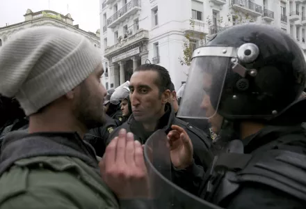 Protestors face riot police during a demonstration in Tunis, Tunisia, Friday Jan. 12, 2018. Tunisia's government says protests appear to be subsiding after anger over food prices led to days of clashes with police that left one dead, dozens injured and widespread damage.