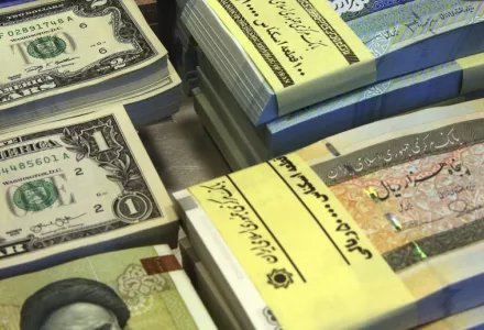 American and Iranian currency notes.