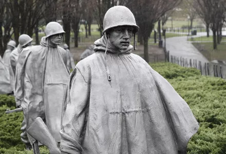 Rain falls on statues at the Korean War Veterans Memorial in Washington, Wednesday, March 25, 2020. 