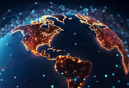 A picture of a globe with many lights representing technology